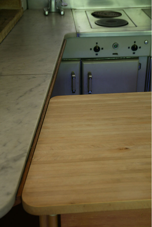 Maison Louis Carré, marble and wood kitchen work surfaces.