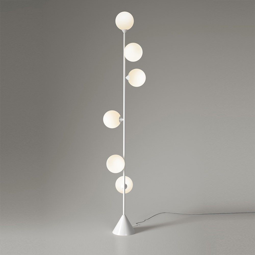vertical globe floor lamp styled in an interior by atelier Areti