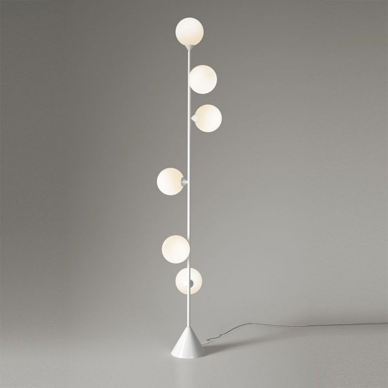 vertical globe floor lamp styled in an interior by atelier Areti