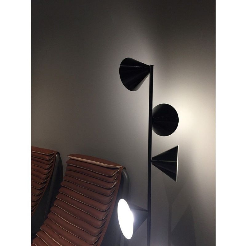 Vertical 1 floor light Areti photographed at the Milan furniture fair