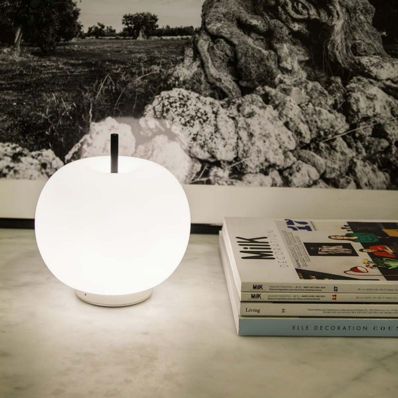 Mobile Kundalini Kushi table lamp styled with magazines