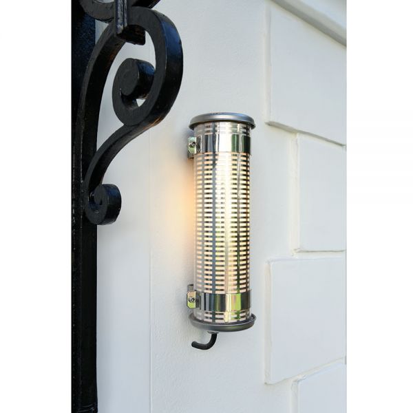 Gude wall light by Sammode photographed by a front door