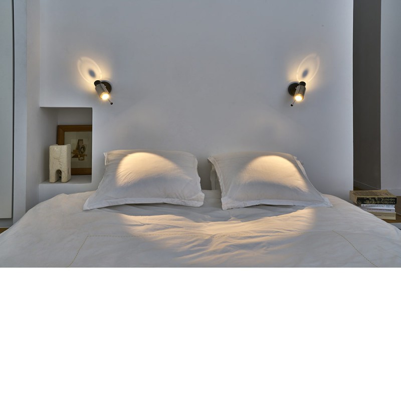 biny spot wall lamp in a room by dcw editions